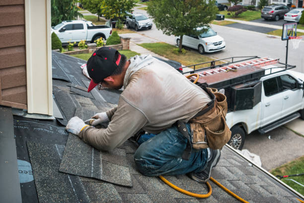 Professional Roofing technician working in Acton, MT